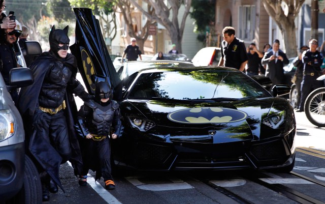 Five-years-old Miles, from Tule Lake, Calif., is dressed in a Batman costume in San Francisco, Friday, November 14, 2014. Miles, who wants to be a Batman, will embark on a series of crime-solving adventures when San Francisco is converted into “Gotham City” as part of a Make-A-Wish Foundation event. He is in a fight on his own in his battle against leukemia since he was a year old. He is now in remission. (Photo: Make-A-Wish Foundation/PaulSakuma.com)